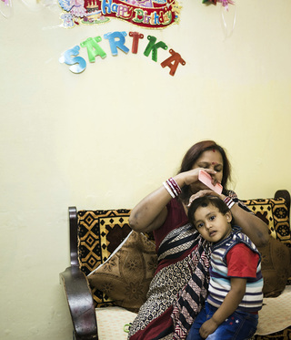 Portrait of residents from the Miron-Jolla-Colony. The brown dot on the forehead of the child is called Tilaka and gets applied to protect children from evil spirits. 