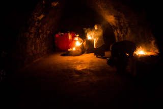 16/02/2017 - Lalish, Iraq: The Lalish temple complex is the holiest Yazidi site where sacred shrines and caves
with tombs are located. A Feraş (servant) who is unmarried and youth lights every
day 365 candles in certain places all over the temples and is accompanied by an older man and woman.