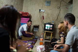 19/09/2016 - Sharya, Iraq: Najla Hussin spends time with her sister, her cousin (right) and her friend Saadon Dawod (left). 