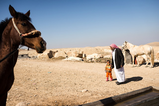 23/02/2017 - Bakera, Iraq: Faqir Hasso with one of the children of his deceased son. On 3rd August 2014 people
fled to Bakera where Mr. Hasso is living at the foot of Mount Shingal. He had stored
water and food as he knew an attack by the Islamic State would happen one day after they captured the city Mosul in June 2014.
